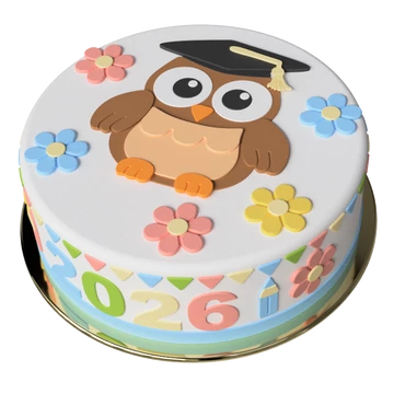 Ballagási sapkás bagoly figura egy virágos tortán